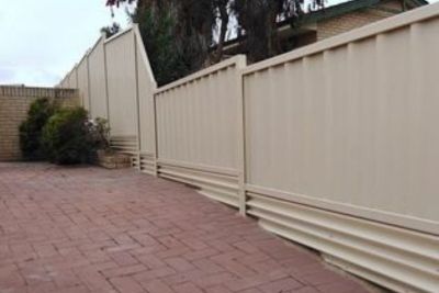 colorbond fence on sloping block with plinth